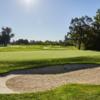 A sunny day view of a green at Santa Rosa Golf & Country Club.