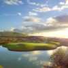 A view of a green surrounded by water at Arrowood Golf Course.