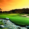 A sunset view of a green at Coyote Hills Golf Course.