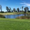 A view of a green with water and sand traps coming into play at Shandin Hills Golf Club.