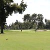A sunny day view of a green at Stockdale Country Club.
