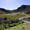 The 16th hole of the Sky Course at Lost Canyons Golf Club is located in the center of the steep canyon.