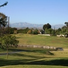 The first hole on the North Course at Royal Vista Golf Club plays over a pond to a difficult green.
