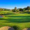 A view of a hole with water and bunkers coming into play at Maderas Golf Club.