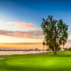 A sunset view of a green at Coronado Golf Course.