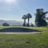 View of a green and bunker at Kern River Golf Course.