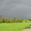 A view of rainbow over the driving range at Bass Lake Golf Course