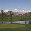Big Rock Golf & Pub at Indian Springs: #18 green in foreground with #15 green and hole on the other side of the lake. Mt. San Jacinto covered in snow in the background