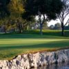 A view of green surrounded by water at Costa Mesa Golf & Country Club.