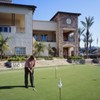 A view of the clubhouse and putting green (courtesy of Hacienda Golf Club)