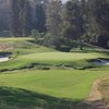 A view of hole #4 flanked by bunkers with narrow path on the right at North Course from Los Angeles Country Club