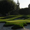 A view of green protected by bunkers at Wilshire Country Club