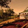 A view of the clubhouse at sunset from Gold Hills Golf Club