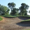 A view of a green protected by bunker at WildHawk Golf Club.