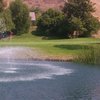 A view of a green with beautiful water fountain in foreground at Shandin Hills Golf Club.