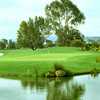 A view over the water of green at Poplar Creek Golf Course