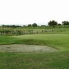 A view of the chipping green and sand bunker at Old River Golf Course