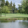 A view over the water of green #15 at San Jose Golf Course