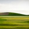 A view of a green protected by sand traps at Hunter Ranch Golf Course