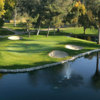 A view of a green surrounded by water at Kings Country Club