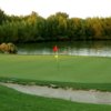 A view of a green with water coming into play at Wildhorse Golf Course