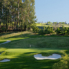 A view of a green surrounded by bunkers at Claremont Country Club