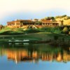 A view over the water of the 18th green and clubhouse at Mayacama Golf Club