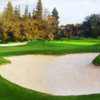 A view of a green protected by tricky bunkers at Glendora Country Club