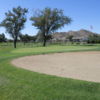 A view of green #18 protected by sand traps at Apple Valley Golf Course