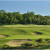 A view of a green protected by bunkers at Serrano Country Club.