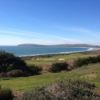 A view of a green flanked by sand traps from The Links At Bodega Harbour