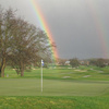 A view of the 2nd hole with rainbow in backgroun at Greenhorn Creek Golf Course
