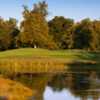 A view of a green with water in foreground at Cherry Island Golf Course