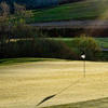 A sunny view of a green at Empire Ranch Golf Club