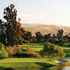 A sunny view from Oak Creek Golf Club with water on the right