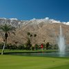 A view of the 9th green with Disney Fountain and snow capped San Jacinto mountains in the background at North Course from Indian Canyons Golf Resort.