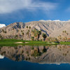A view over the water of the clubhouse at Indian Canyons Golf Resort - South Course