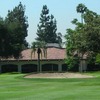 A view of the clubhouse with bunker in foreground at Brookside Golf Club