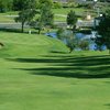 A green view with bunker on the left at Indian Hills Golf Club 