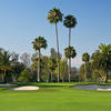 A view of green surrounded by bunkers at Teal Bend Golf Club