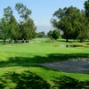 A view of green surrounded by bunkers at San Bernardino Golf Club
