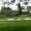 A view of the clubhouse with a green in foreground at Annandale Golf Course
