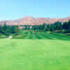 A sunny day view of a green at Yucaipa Valley Golf Club