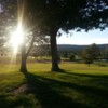 A sunny day view of a hole at Arrowhead Golf Course.