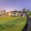 A view of the clubhouse and practice putting green at Peach Tree Golf & Country Club.