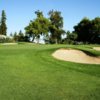 A view of a green protected by tricky bunkers at Turlock Golf & Country Club.