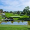 A view over the water of hole #9 at Twin Oaks Golf Course.