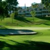 A sunny day view of a hole at San Vicente Golf Resort.