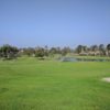 A sunny day view of a hole at Rancho San Joaquin Golf Course.
