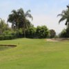 A sunny day view of a hole at Arrowhead Country Club.